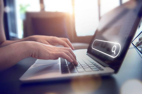 Closeup hands using laptop with Searching Browsing Internet Data Information Networking Concept